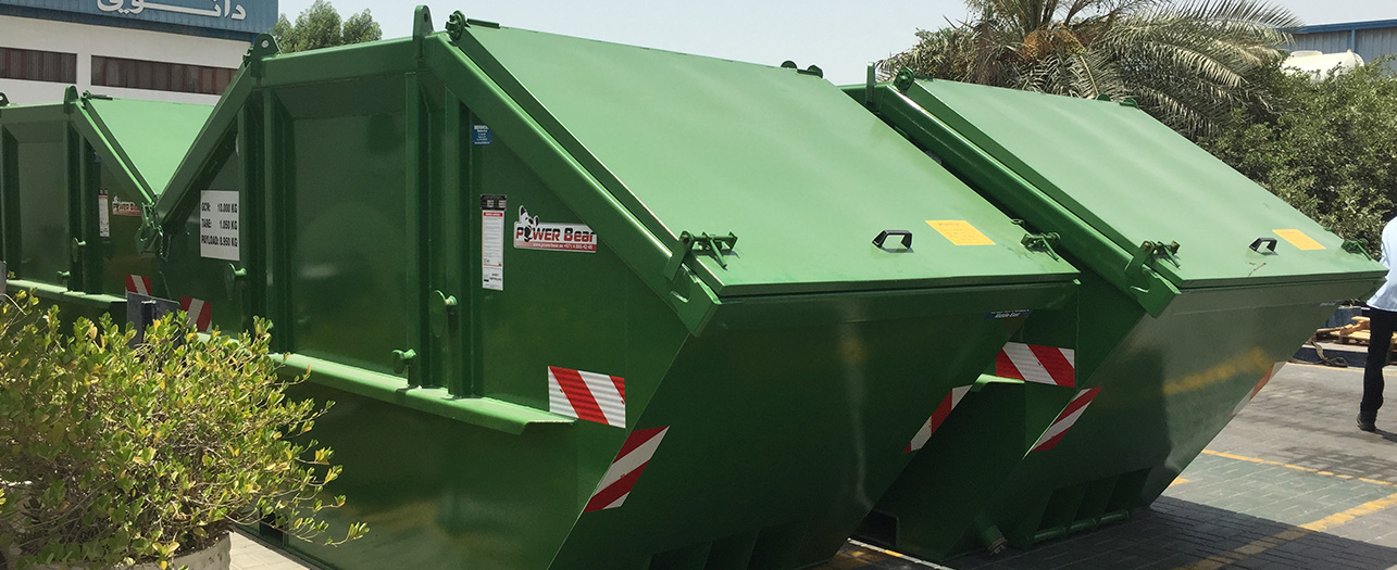 Green waste skip containers placed outdoors for waste collection