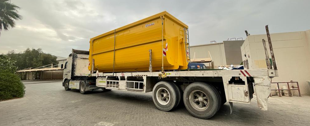 Yellow waste container on a truck for efficient waste routing operations