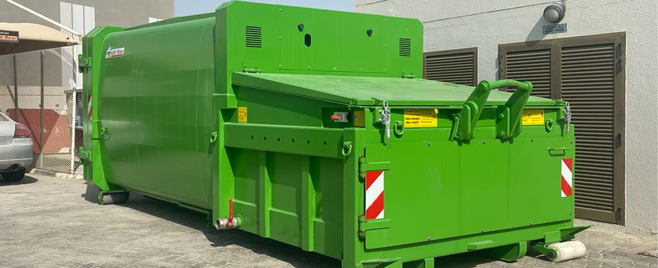 Industrial green waste compactor placed outdoors