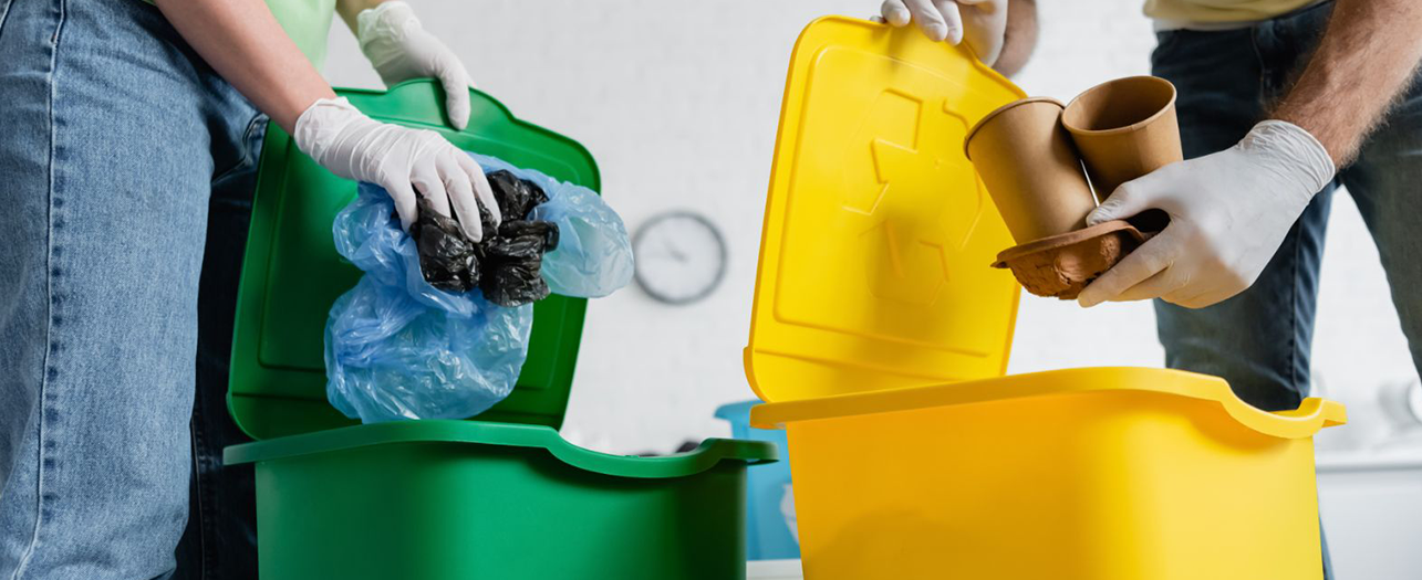 People sorting recyclables for waste disposal