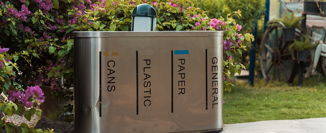 Outdoor garbage bin with separate sections