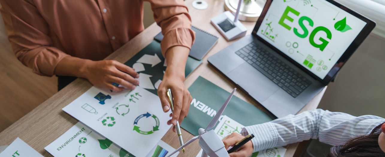 Team discussing ESG sustainability strategy at a desk