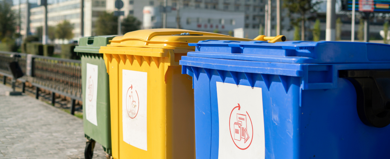 three color trash bins in the city