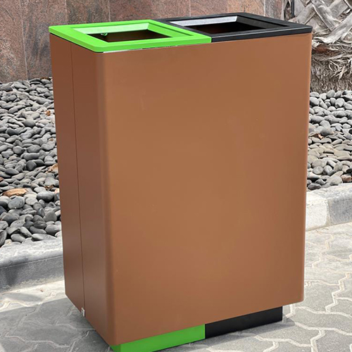 Dual-compartment outdoor trash bin with green and black openings