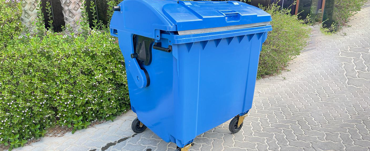 Blue 4-Wheel Bin placed outdoors for waste collection
