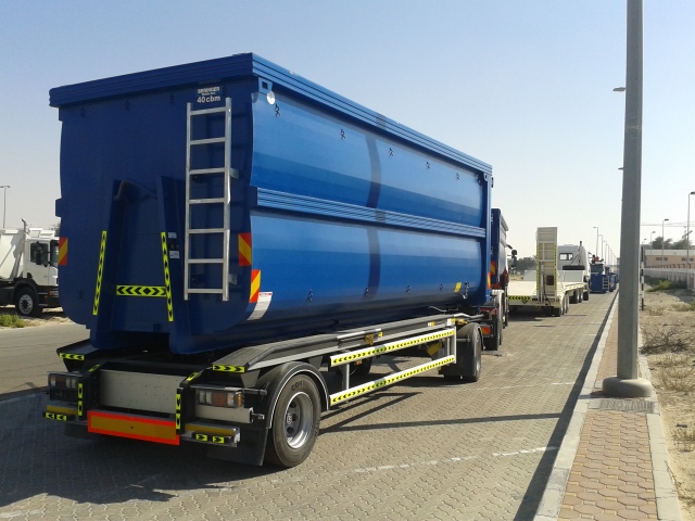 Green outdoor recycling compactor bin